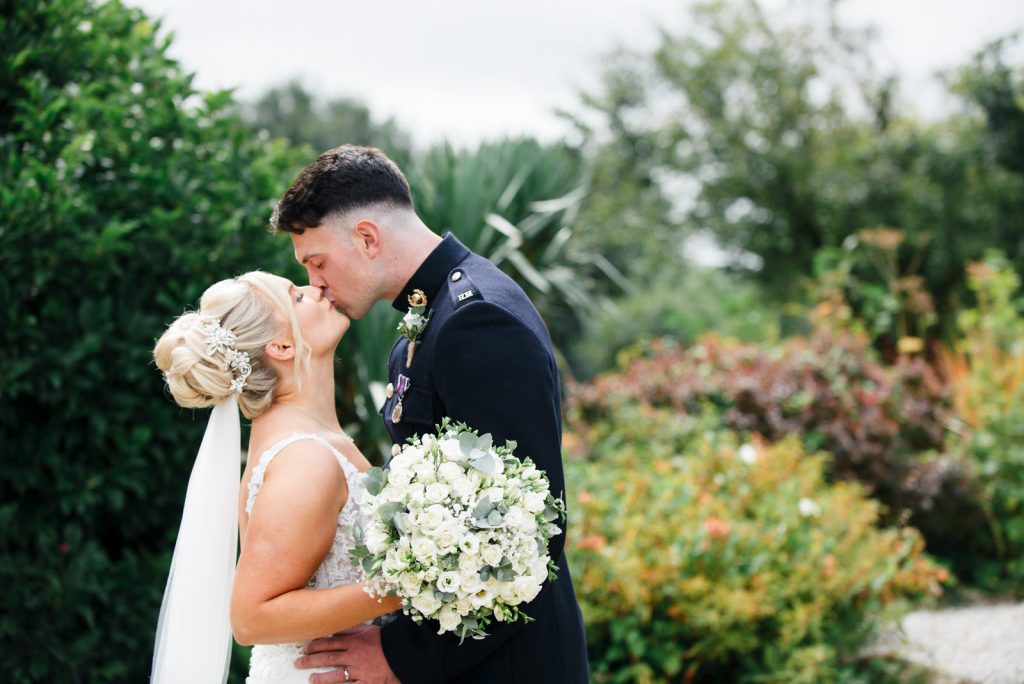 Newlyweds sharing a kiss at The Green Cornwall captured by Memories &amp; Milestones Photography